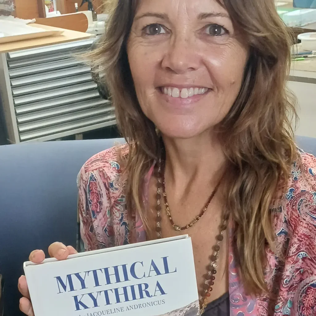 Jacqueline Andronicus holding her new Mythical Kythira book.